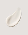 COOLA classic face lotion formula swatch against neutral background