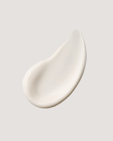 COOLA classic face lotion formula swatch against neutral background