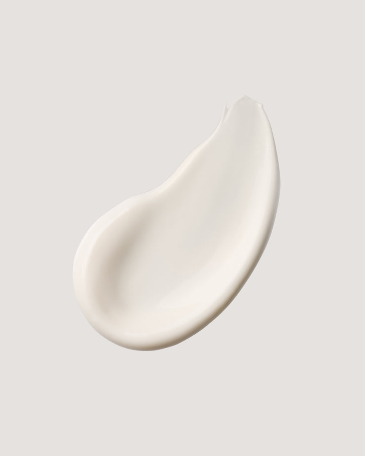 COOLA classic face lotion formula swatch against neutral background