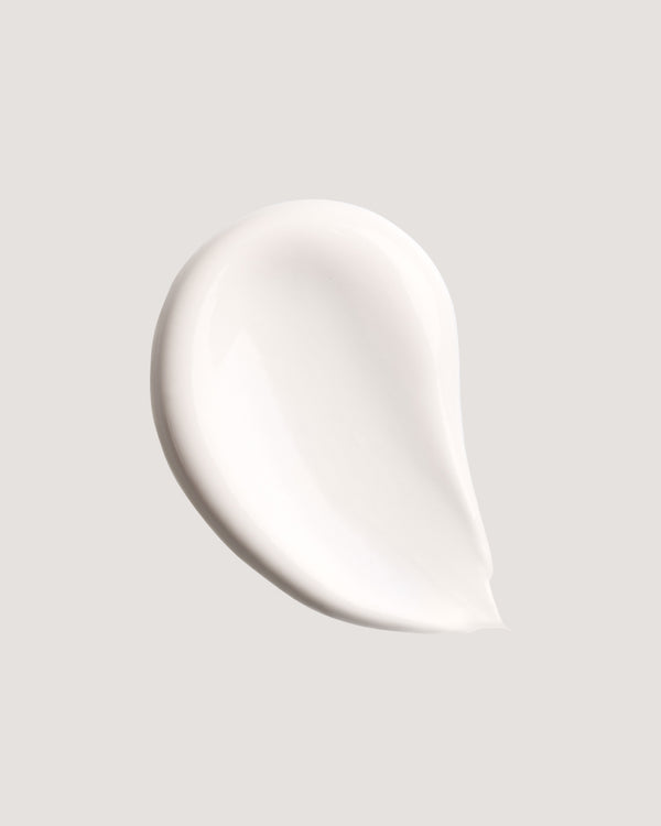 Mineral sunscreen formula swatch against neutral background.