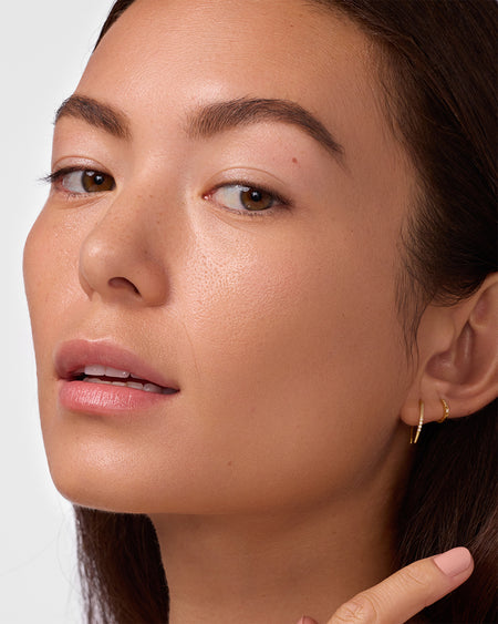 Close-up of person's face after tinted sunscreen application