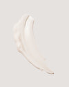 Formula swatch of Sunless Tan Firming Lotion against beige background.