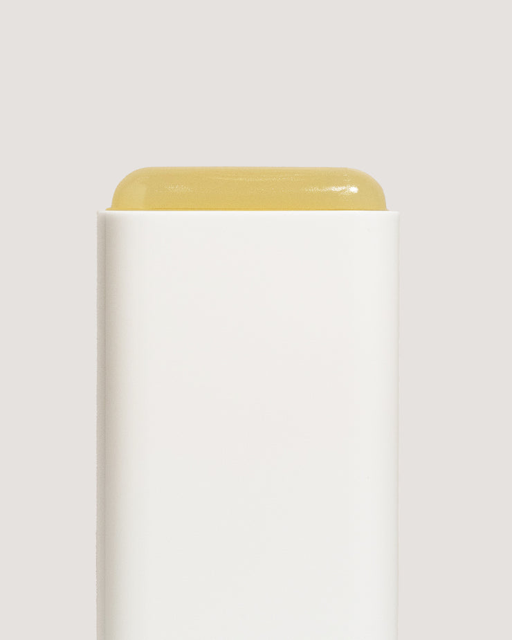 COOLA Classic Sunscreen Stick Tropical Coconut uncapped showing formula