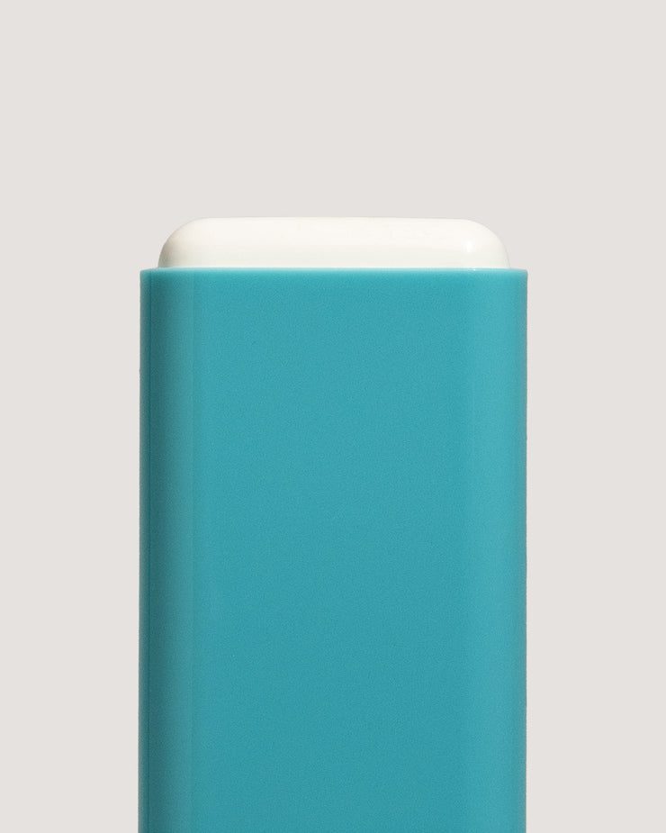 COOLA Mineral Sunscreen Stick uncapped showing formula with teal body