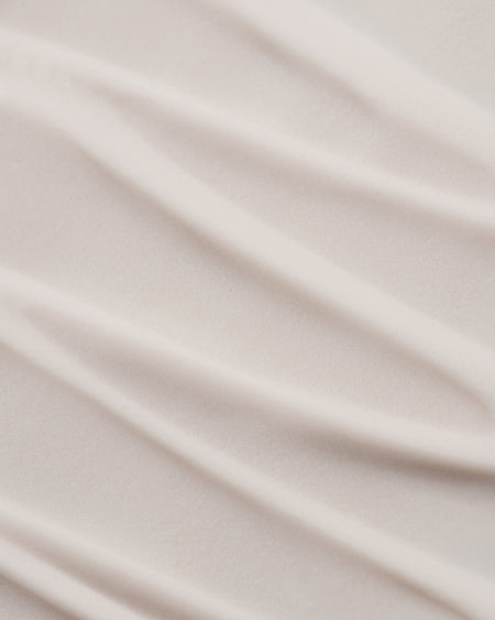 Close-up of COOLA Clear Skin Oil-Free Moisturizer Zinc Oxide Sunscreen formula