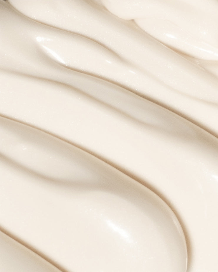 Close-up of COOLA Dew Good Illuminating Body Melt Lotion SPF 40 formula