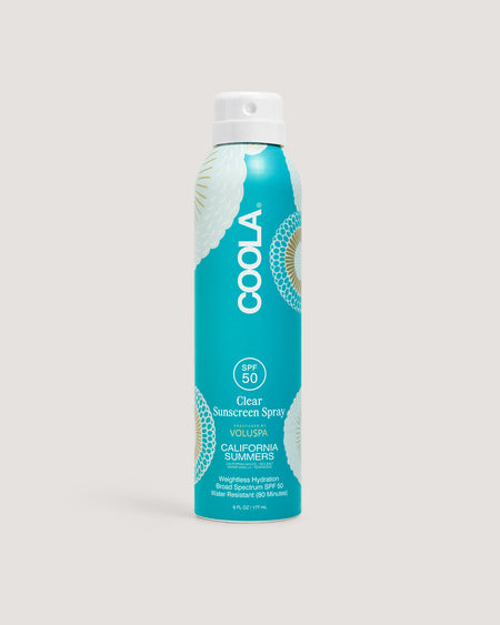 Coola California Summers sunscreen spray standing up against beige background
