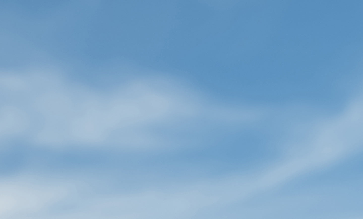 Blue sky with soft clouds