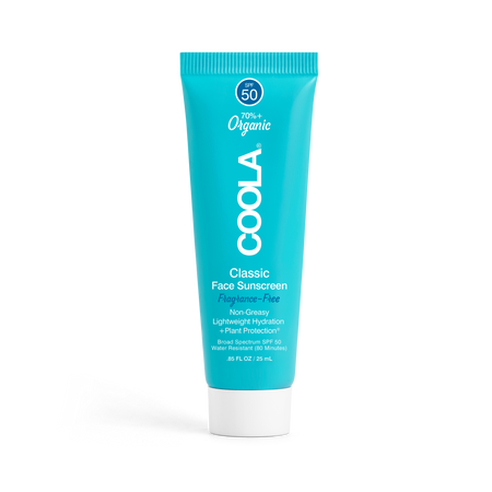 Travel sized Coola face sunscreen lotion on a transparent background