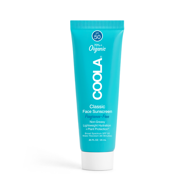 Travel sized Coola face sunscreen lotion on a transparent background