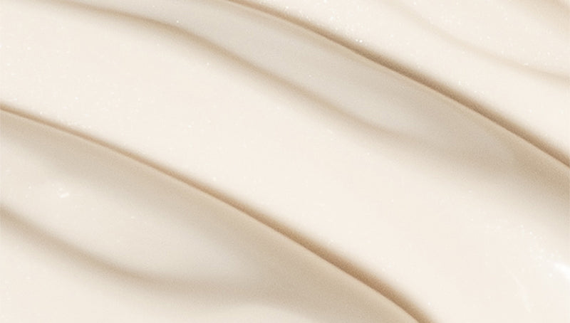 Close-up of white sunscreen formula in wave texture