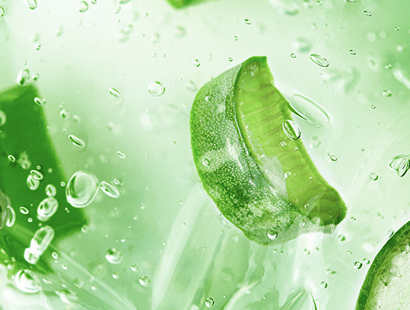Close up of aloe vera gel with pieces of aloe vera in it