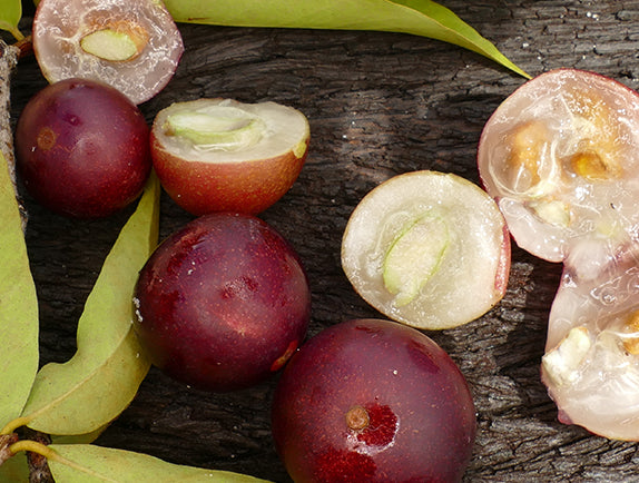 Camu camu fruit laying on wooden surface