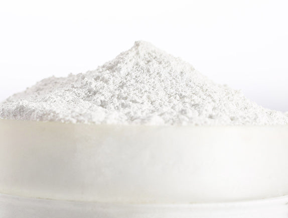 White minerals in small pile with white background