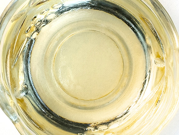 Yellow oil in glass jar