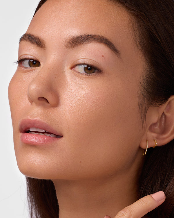Close-up of person's face after tinted sunscreen application