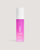 COOLA Rewakening Rosewater Mist in pink bottle on beige background.