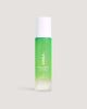 A bottle of COOLA Glowing Greens Detoxifying Facial Cleansing Gel against neutral background.