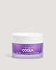 A jar of COOLA Day SPF 30 & Night Eye Cream, with a purple label and a white lid.