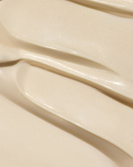 Dew Good Body Melt Lotion with a smooth creamy texture spread in soft swirls for a luxurious organic skincare experience