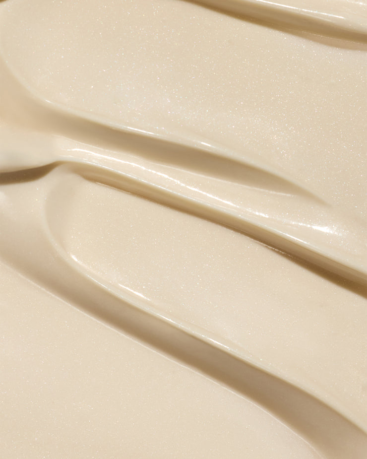 Dew Good Body Melt Lotion with a smooth creamy texture spread in soft swirls for a luxurious organic skincare experience