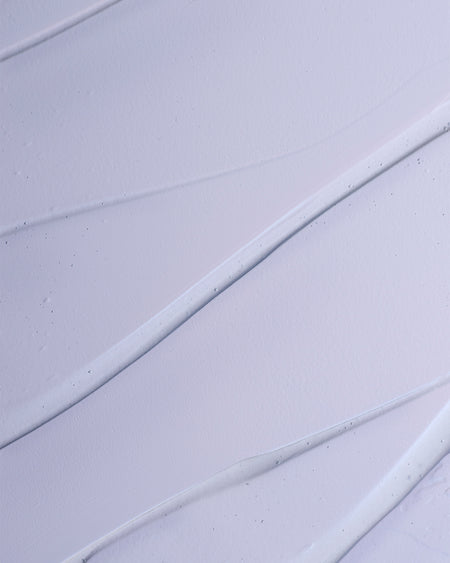 Close-up of a textured purple surface with diagonal lines