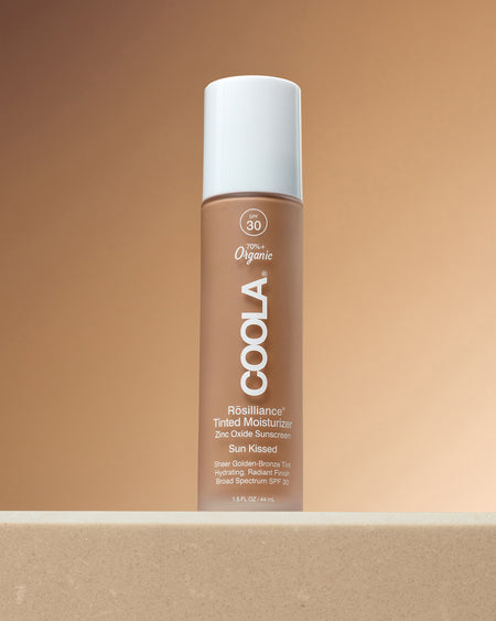 Rosilliance® Tinted Moisturizer - Sun Kissed bottle with SPF 30, a warm tinted shade, white cap, and organic skincare formula on a neutral background