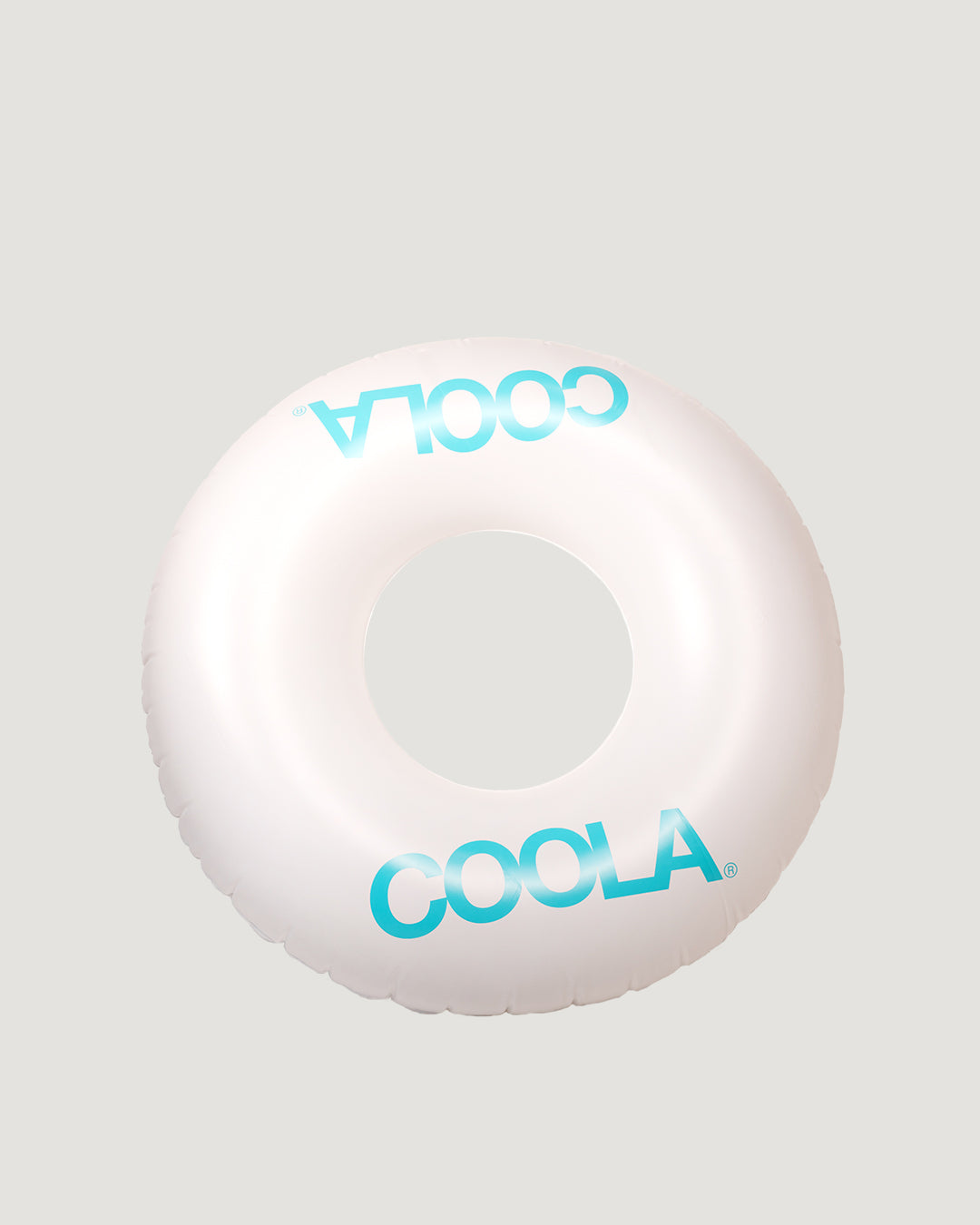 A white ring-shaped pool float with the brand name 'COOLA' written in blue letters.