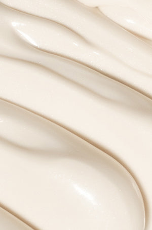 Close-up of white sunscreen formula in wave texture