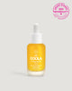 A bottle of COOLA Firming Face Oil with a dropper, highlighted by a '2025 NewBeauty Award Winner' badge.