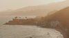 Drone video of coastline during sunset